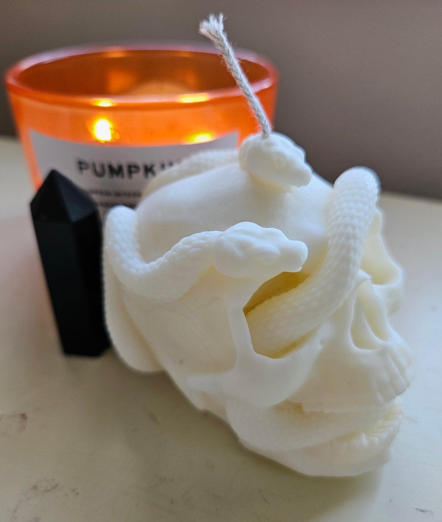 Snake skull candle