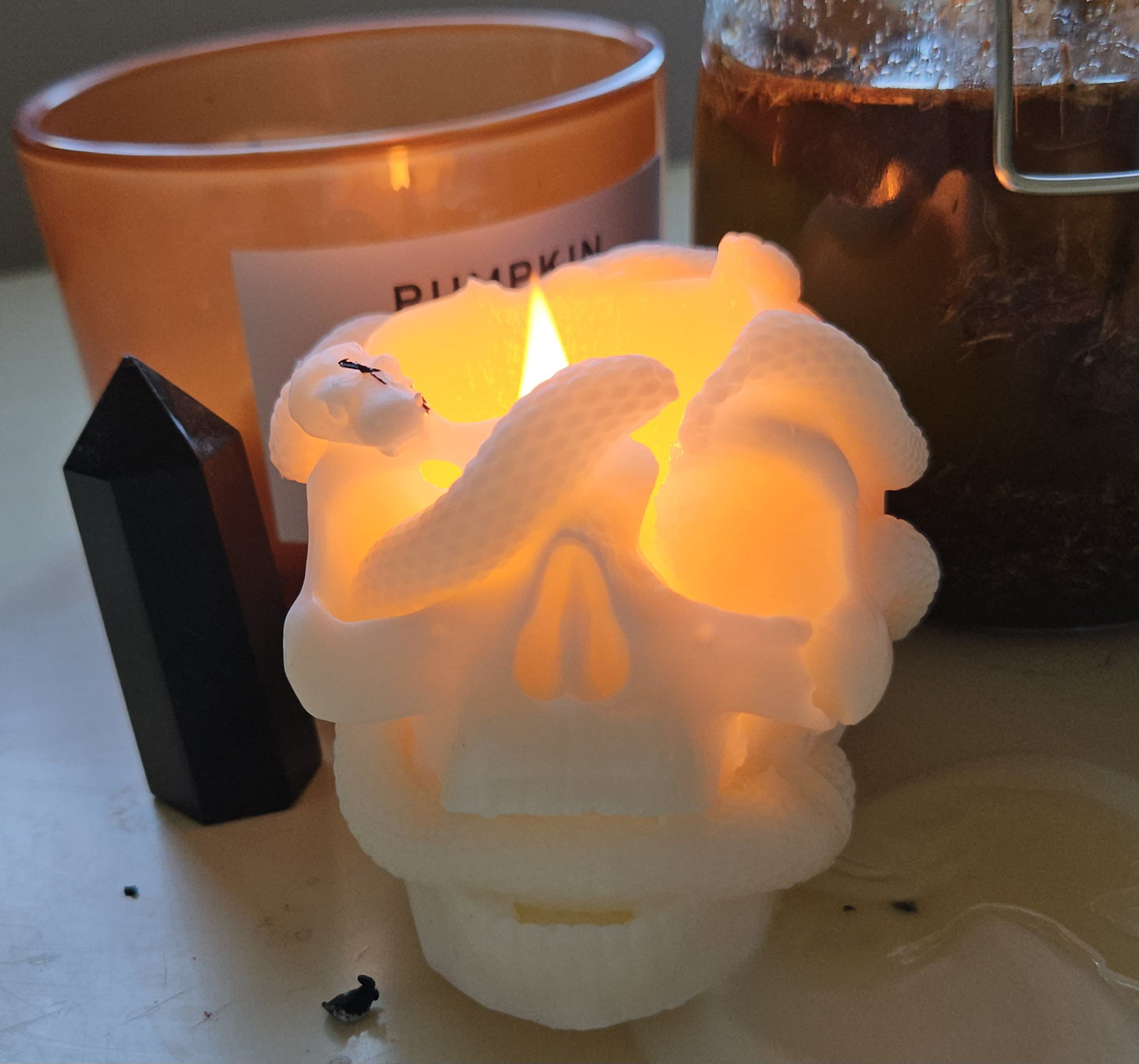 Snake skull candle